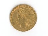 a gold coin with an indian head on it
