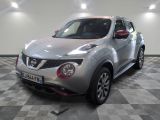 une photo d'un SUV Nissan Juke argenté garé dans un garage