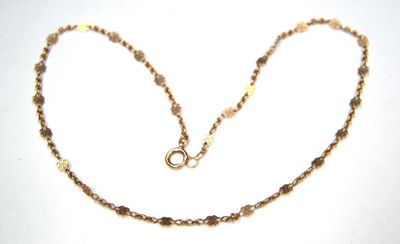 gold plated necklace with faceted glass beads and a clasp