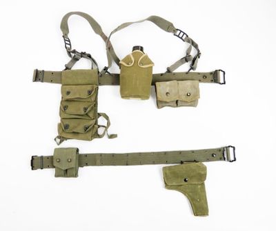 an image of a pair of holsters and a belt on a white background