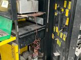 a machine that is sitting inside of a cabinet