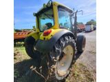 a close up of a tractor parked on the side of a road