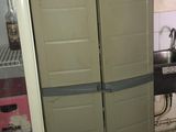 a refrigerator in a kitchen with a refrigerator door open