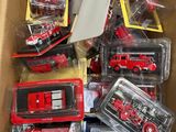 a box full of toy fire trucks and other toys