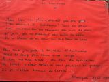 a red piece of paper that has writing on it