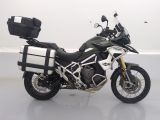 a black and white motorcycle parked in a white room