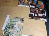 a lot of pictures on a table with a lot of writing on it