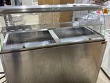 an image of a stainless steel counter top with two sinks in it