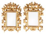 pair of gold framed mirrors on a white background