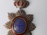 an image of a close up of a medal on a white surface