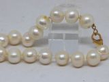 white pearl necklace with gold clasp and clasp