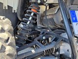 a close up of the front suspensions of a vehicle
