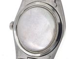an image of a close up of a wrist watch on a white surface