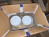 two empty bowls in a cardboard box on the floor