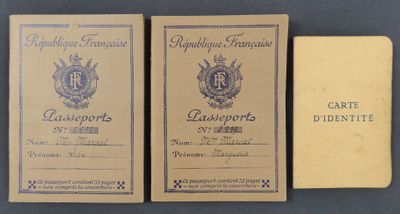 three old french passport cards sitting next to each other on a table