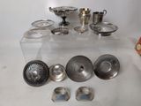 a lot of silver items sitting on a table