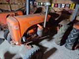 a tractor that is sitting in a garage