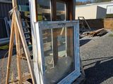 a ladder that is next to a window on the ground