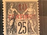 un vieux timbre-poste sur lequel figurent une femme et un homme
