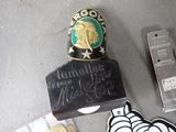 some badges and a lighter on a table