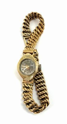 an image of a gold watch with a chain around it