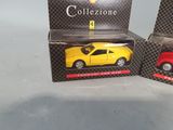 two toy cars that are in a box on a table