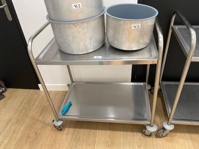 two buckets on a metal cart next to each other