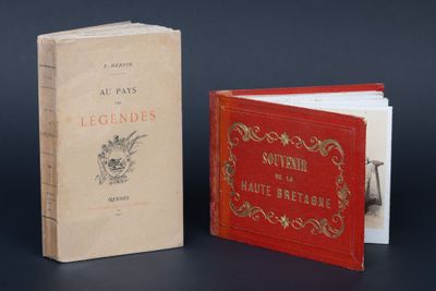 two books are sitting next to each other on a table