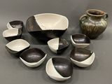 many bowls and spoons that are sitting on a table