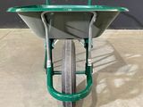 a green wheelbarrow with a wheelbarrow on it