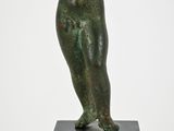 an image of a bronze statue of an angel on a black pedestal