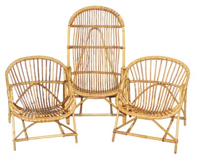 two chairs made out of bamboo are sitting next to each other