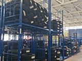the warehouse is full of tires and racking for sale