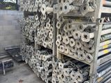 several rolls of toilet paper are stacked on a rack in a warehouse