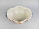 a small bowl that has a flower design on it