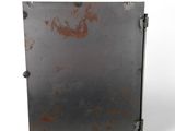 an old metal box with rust on it on a white surface