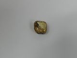 an image of a piece of gold on a white surface