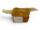 yellow glass bird figurine on a white background with a label on it