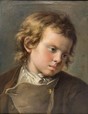 portrait of a young boy in a brown coat and white shirt