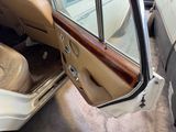 a car door open with the driver ' s seat in it