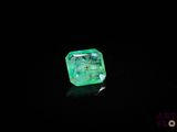 a green emerald in the dark