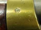 an image of a close up of a metal object with a wooden handle
