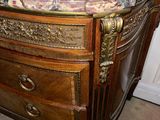 a marble top on a wooden cabinet in a room