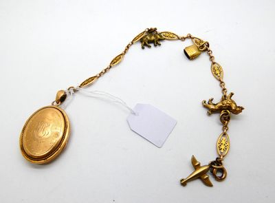 an image of a gold necklace with a coin and a bird charm