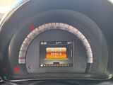 a car dashboard with a speedometer and a clock on it