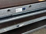 an image of a metal table with a drawer underneath it