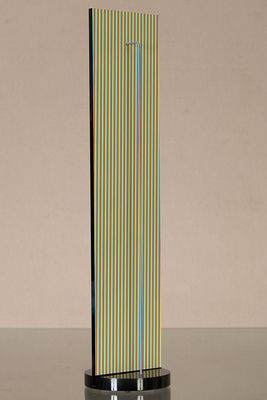 an image of a tall glass sculpture with a colorful stripe design