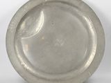 an antique silver plate on a white background with a white background