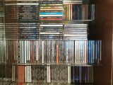 a glass case with many dvds on it