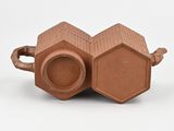 a brown object that is sitting on a white surface